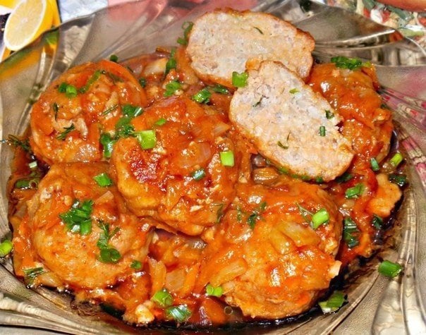 Meatballs with rice in tomato sauce