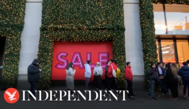 Shoppers queue outside Selfridges on Oxford Street for Boxing Day sales