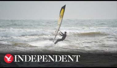 People kite and windsurf on Avon Beach as Storm Gerrit hits UK