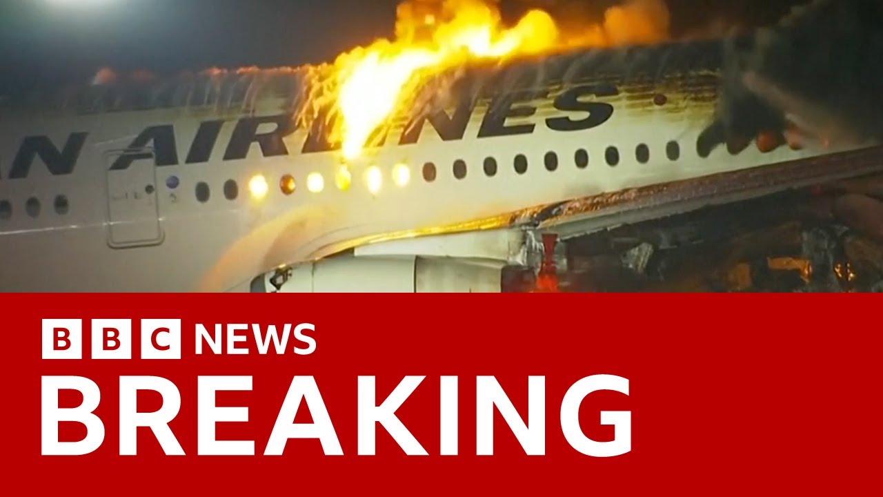 Japan Airlines plane in flames on the runway at Tokyo's Haneda Airport -BBC News