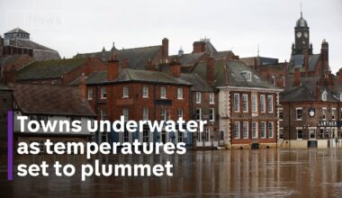 UK flooding: towns underwater as temperatures set to plummet