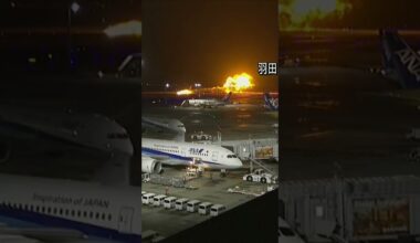 Moment Japan Airlines plane burst into flames