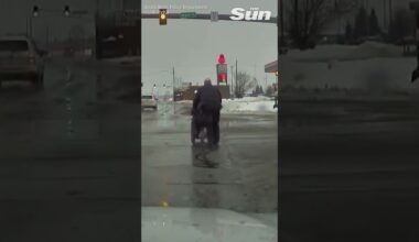 Heartwarming video shows moment Indiana officer helps wheelchair user cross busy intersection