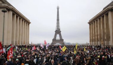 Tens of thousands of protesters across France call on Macron not to sign immigration law