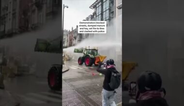 Farmers smash through police barricades and dump manure in protest over EU policies