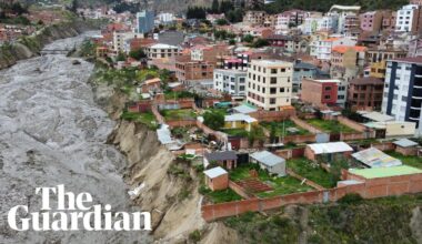 Torrential rains batter Bolivia with homes teetering on the edge of collapse