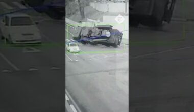 Moment Russian armoured vehicle overturns on a road