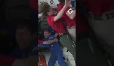 Moment astronauts hug as they arrive at the International Space Station