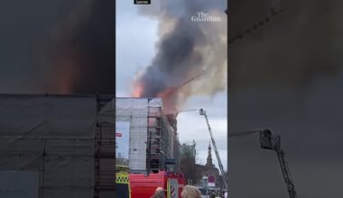 Moment spire collapses at Copenhagen's old stock exchange