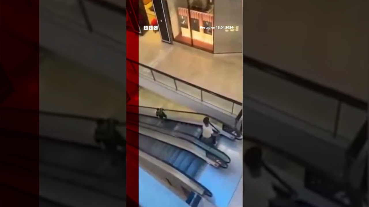 A civilian was filmed confronting the Sydney knifeman on the mall escalators. #Shorts #BBCNews