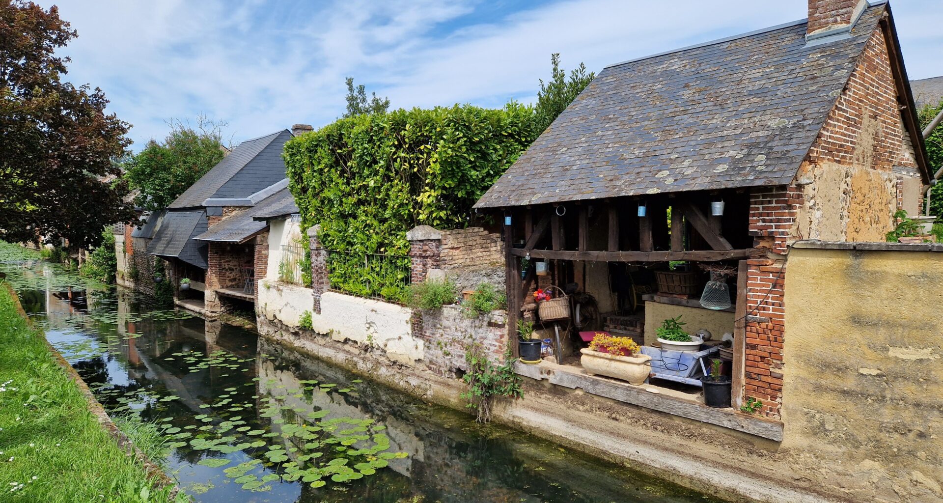 🥾 Lavoirs - communal washing places - along the water (Ozanne river) in Brou which is a commune in the Eure-et-Loir department, France, Europe