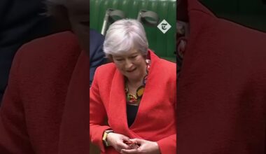 Theresa May hugs Ian Blackford before farewell speech