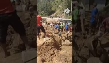 Villagers march with shovels to clean up landslide-hit areas of Papua New Guinea