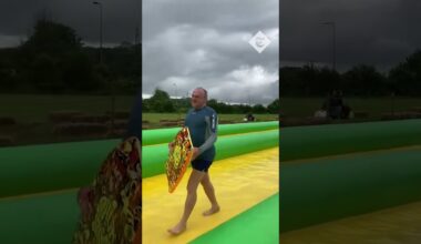 "Lib Dems are go!": Ed Davey blitzes down a waterslide in Somerset