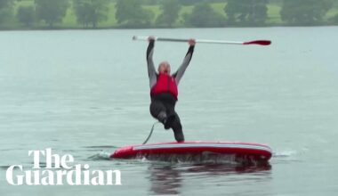 Liberal Democrat leader Ed Davey slips off paddleboard into lake