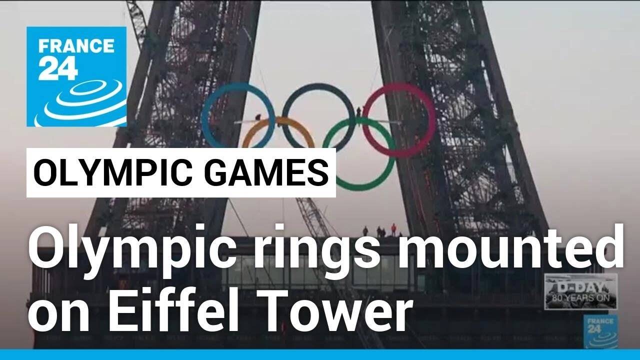 Olympic rings mounted on Eiffel Tower with 50 days to go until Paris Games • FRANCE 24 English