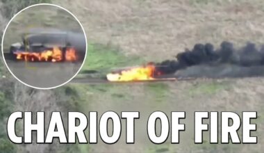 Flames engulf a Russian armoured vehicle as it blazes across the battlefield after a drone strike