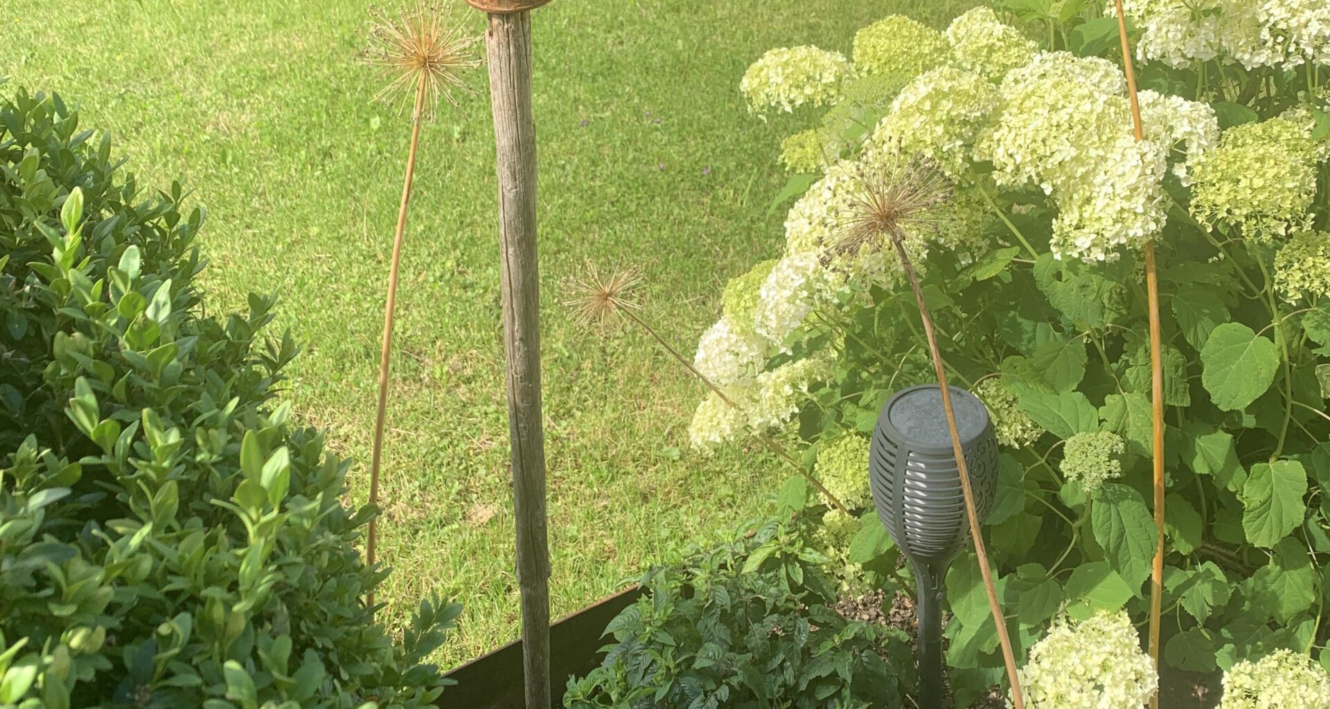 Meinung zu dieser Deko mit einer Dose auf einem Stock?