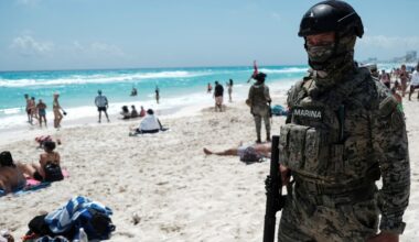 Gunmen open fire at rival drug dealers at a Cancun beach. A 12-year-old boy was left dead.