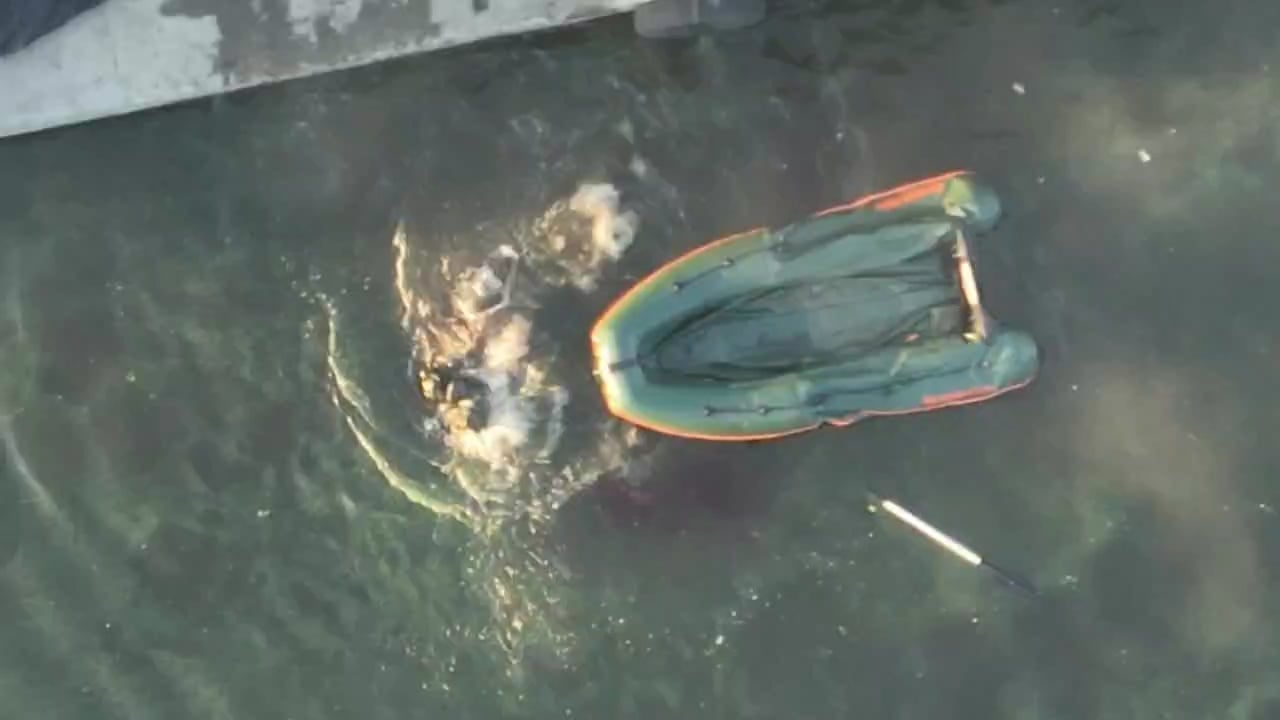 Drone dropped grenade lands directly in the middle of 3 Russian soldiers on a dinghy, all of them fall out and eventually go under. Video by Horskyi Hora.