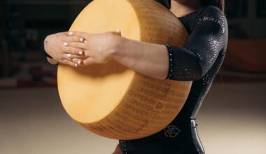 Italian Olympic gymnast Giorgia Villa is sponsored by parmesan cheese and takes many of her photos while posing with large wheels of cheese