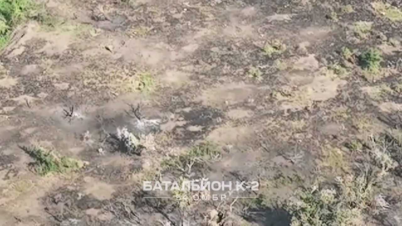 Ukrainian 54th Mechanized Brigade's "Battalion K-2" witnessed a pair of Russian soldiers walking across an open field in the direction of a Ukrainian trench position. One of the two Russians is hit with small arms fire, while the other retreats