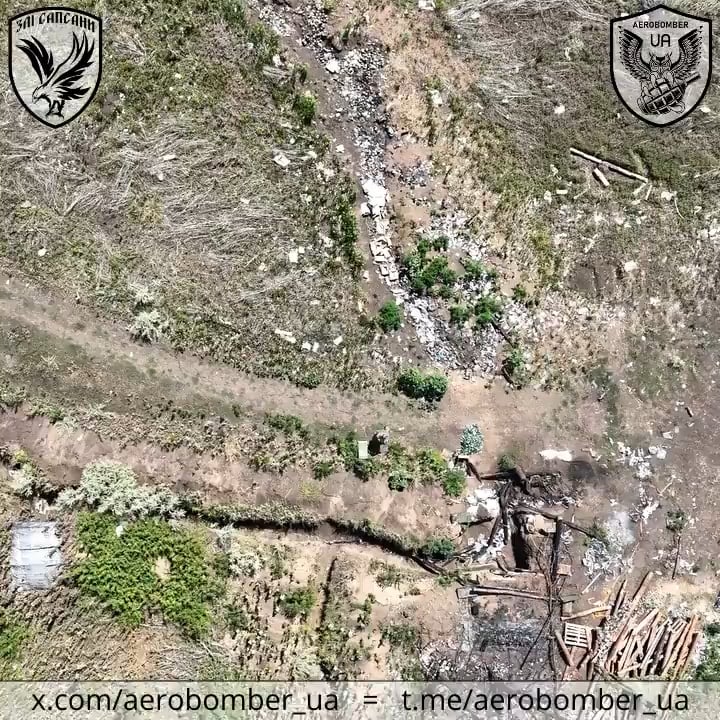 A Ukrainian drone drops munitions on a Russian soldier carrying multiple water bottles. He falls, then eventually gets up and moves into a dugout, where more grenades follow.