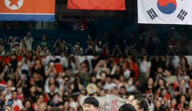 North and South Korean players grab a selfie with the Chinese after the table tennis mixed doubles finals