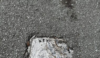 Is it weird that this small bit of pavement outside my house (approx 10 x 10cm) is patched up with duct tape?