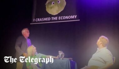 Liz Truss storms off stage after lettuce banner stunt