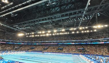 .5 photo from the pool this morning (seated athlete spectator section). I’ve never been to a swim meet like this, the crowd is amazing, especially when a French swimmer races!