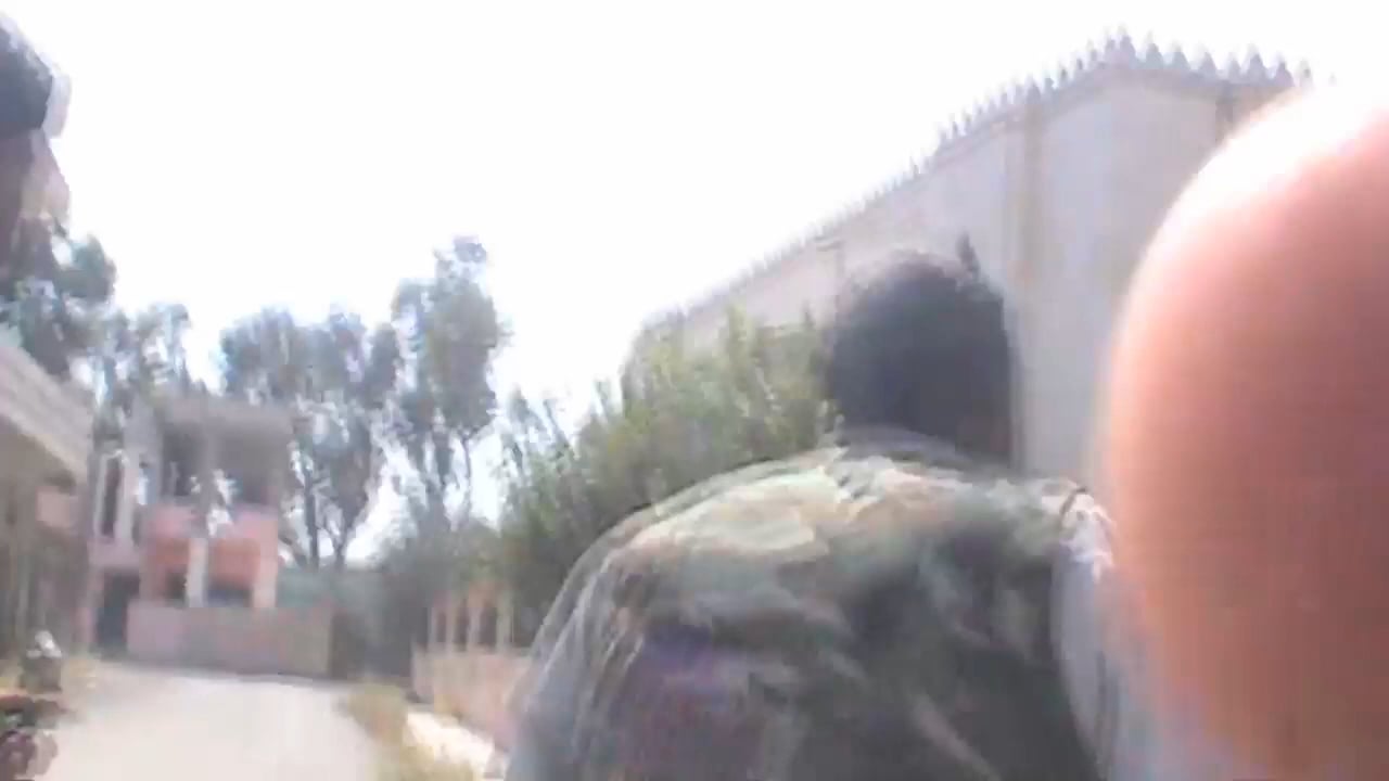 FSA fighters provide cover & assistance to a wounded comrade caught under SAA fire - Khirbet Ghazala, Daraa - 5/10/2013