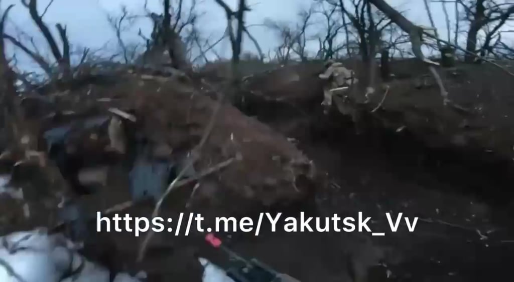 Archival GoPro footage of Russian soldiers during an assault, they are dropped off by armor while under fire and continue to assault a fortified position, Southern Donetsk, no music