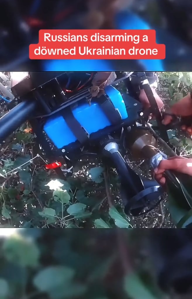 Russians disarming captured Ukrainian drone