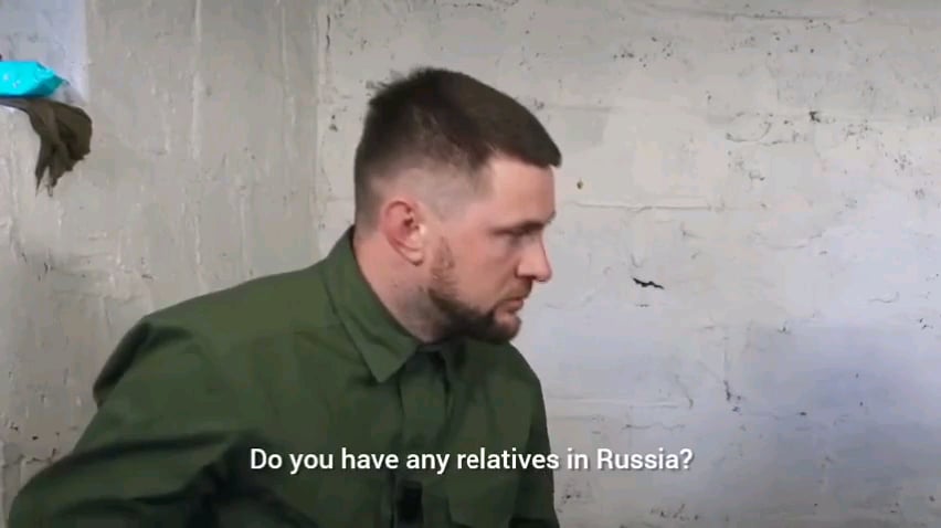 A russian POW being questioned by a Ukrainian rapper Yarmak.