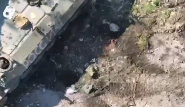 Russian armored personnel carrier runs over their own soldier, while Ukrainian drone drops grenades