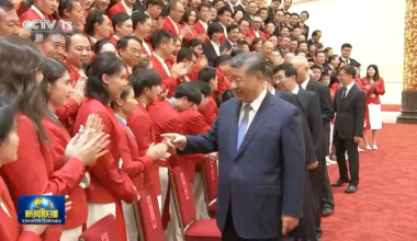 Chinese Olympians greet President Xi Jinping at their homecoming celebration