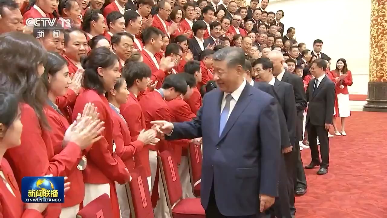 Chinese Olympians greet President Xi Jinping at their homecoming celebration