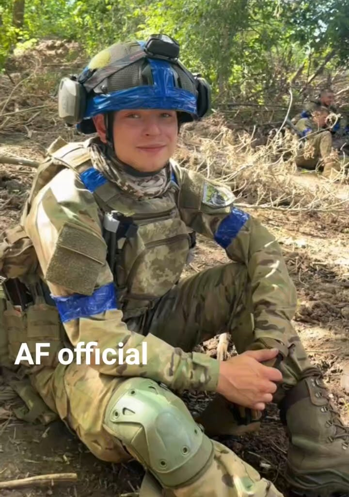 Youthful Ukrainian volunteers take a break on patrol.