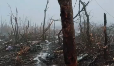 Russians visiting aftermath from some battle during winter.