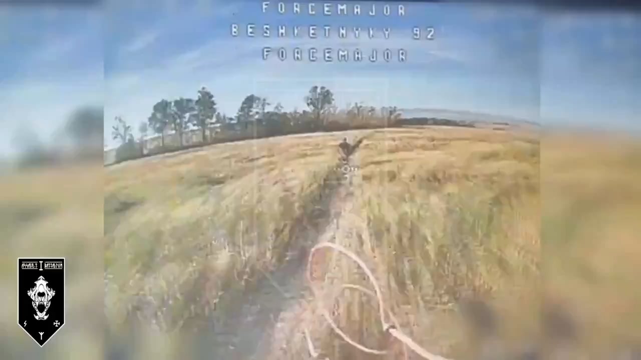 A Russian soldier carrying a gas canister back to his position through an open field is getting chased by a Ukrainian FPV quad.