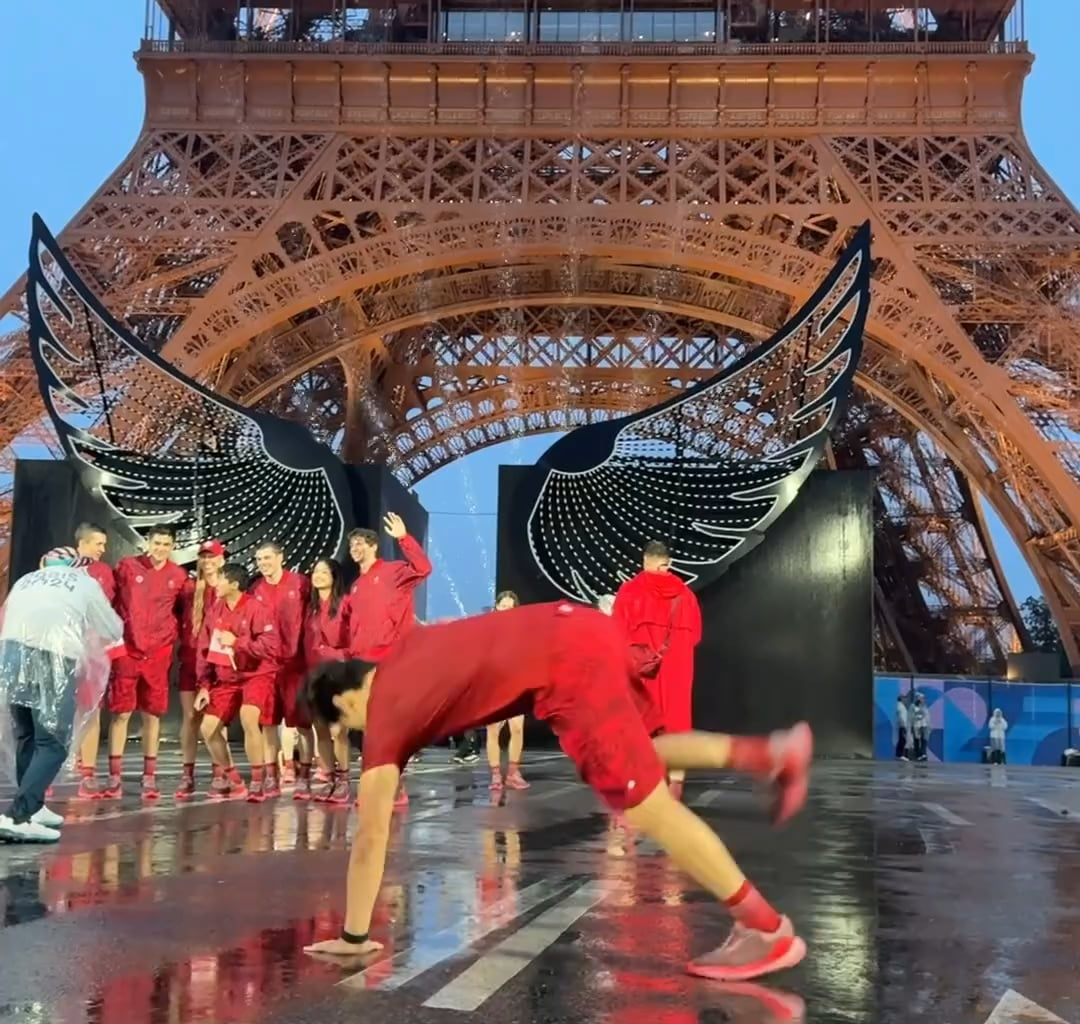 Breakdancing gold medalist Phil Wizard breaking under the rain during the opening ceremony