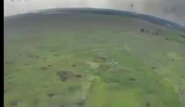 Ukrainian FPV drone takes down a Russian Mavic drone about to perform a drone drop