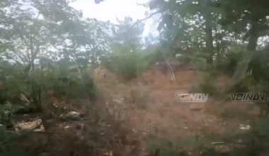 Russian soldier hears a cluster munition going off nearby, some moments later he shoots an FPV drone with a few shots