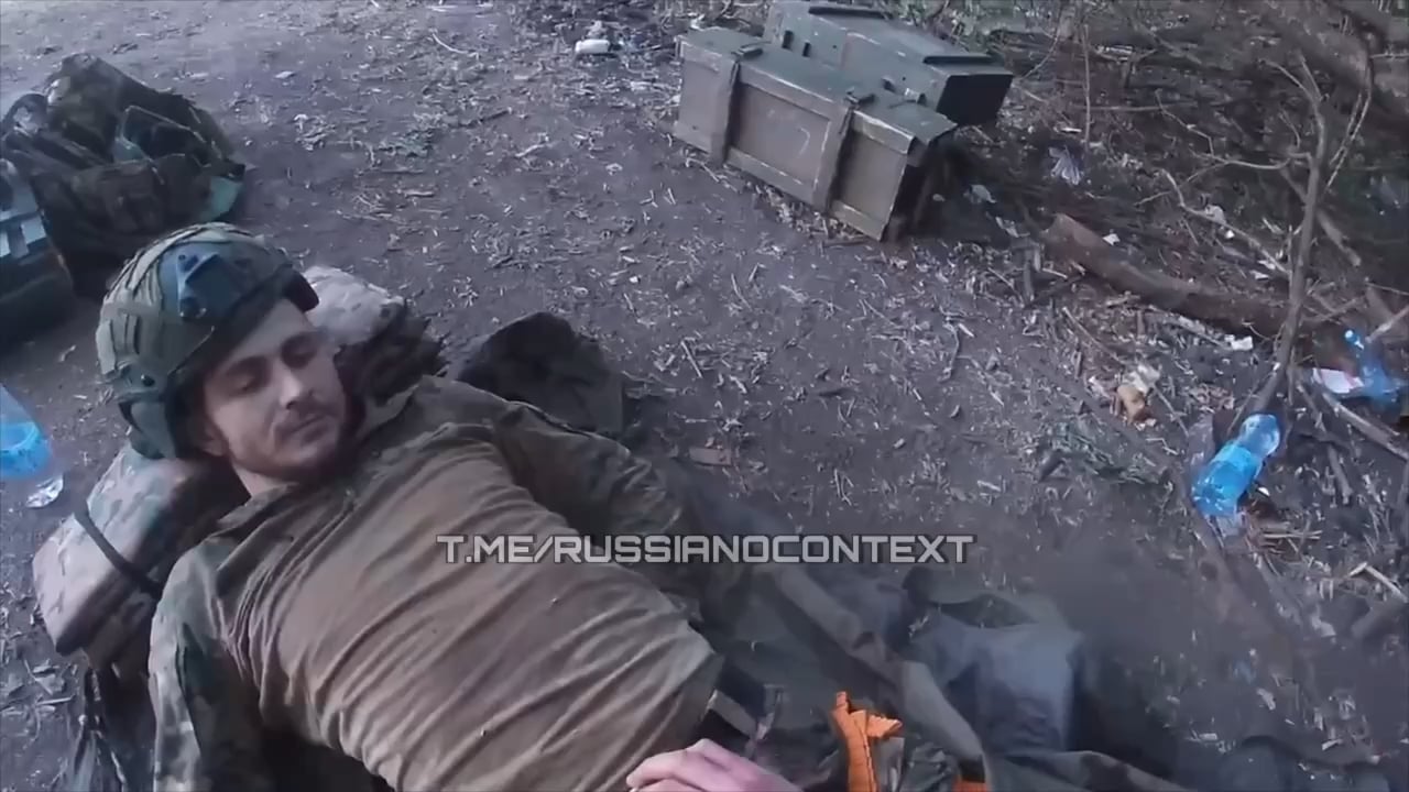 Russian medic was in the process of helping a soldier with destroyed legs, but could not provide the medical aid because of an accurate Ukrainian mortar strike which wounded him as well