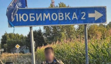 Australian volunteer soldier in the Ukrainian Army - at a road sign, in the Kursk Oblast.