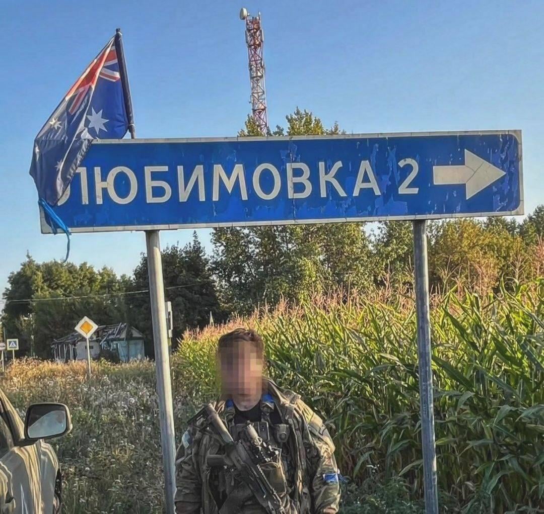 Australian volunteer soldier in the Ukrainian Army - at a road sign, in the Kursk Oblast.