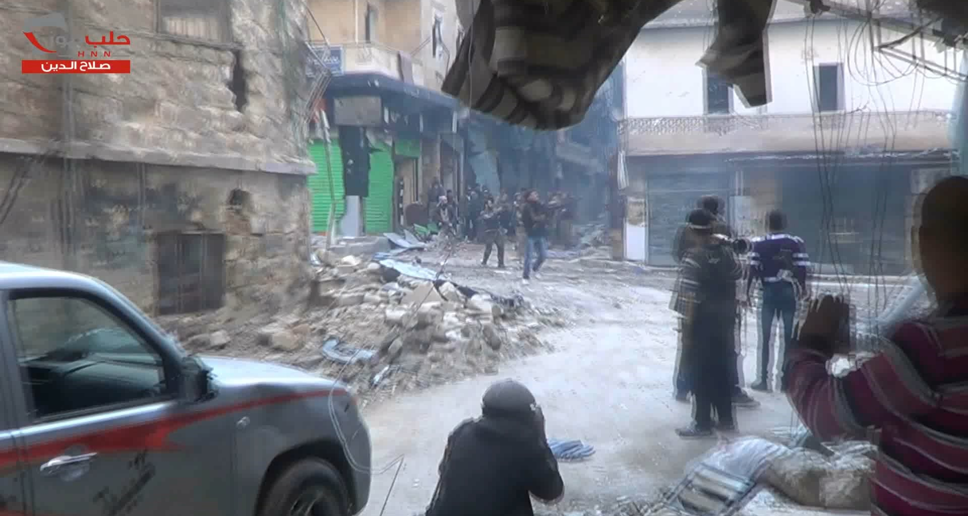 Large group of FSA fighters pull back from an operation to take Aleppo International Stadium - 2012