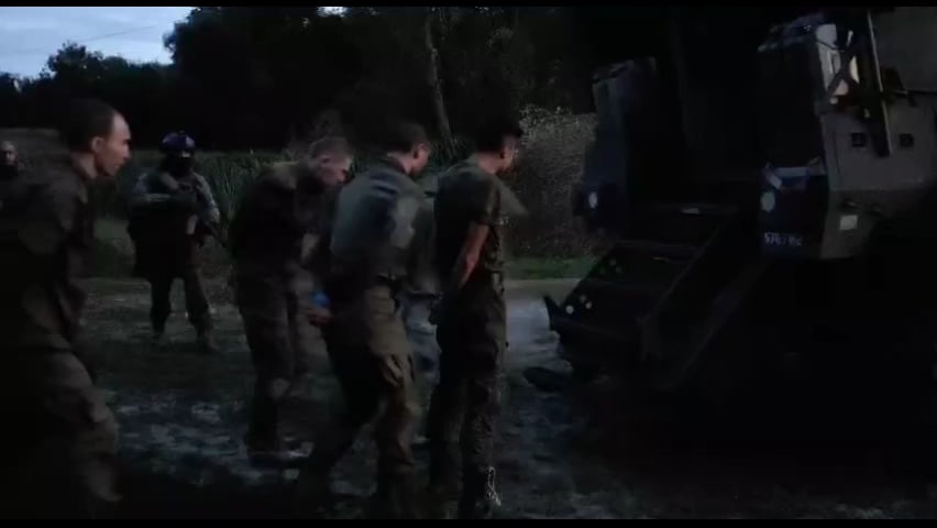 Russian POWs being loaded into a MaxxPro MRAP on the kursk front