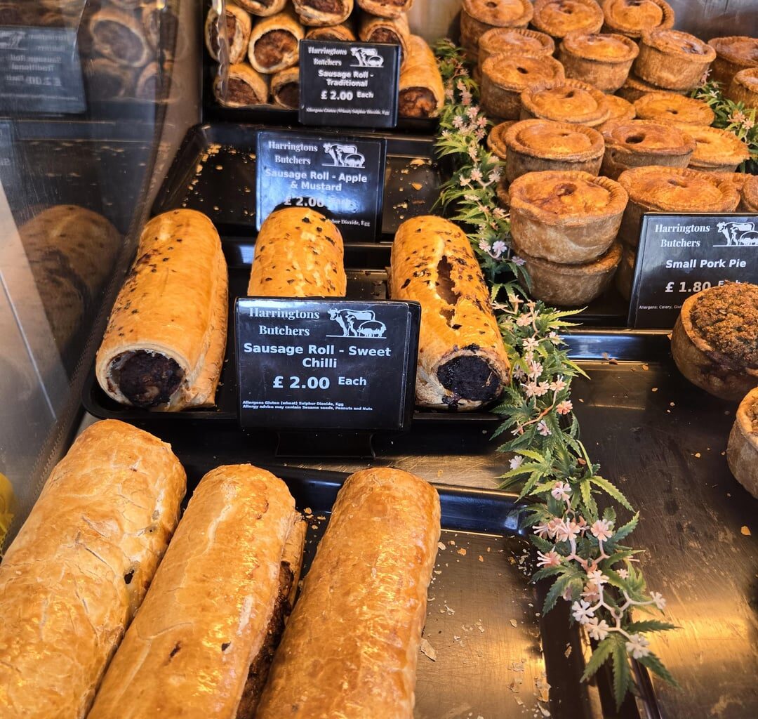 Lunch Bargains from the butcher local to my office. Pen for scale of the hot roast pork and crackling, which is £3.50. Can you beat that? The sausage rolls are a meal in themselves!